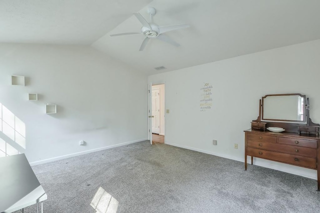 carpeted bedroom featuring vaulted ceiling, baseboards, and ceiling fan