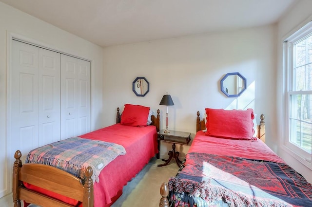 carpeted bedroom with a closet