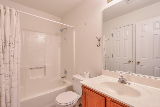 bathroom with shower / bath combination with curtain, toilet, and vanity