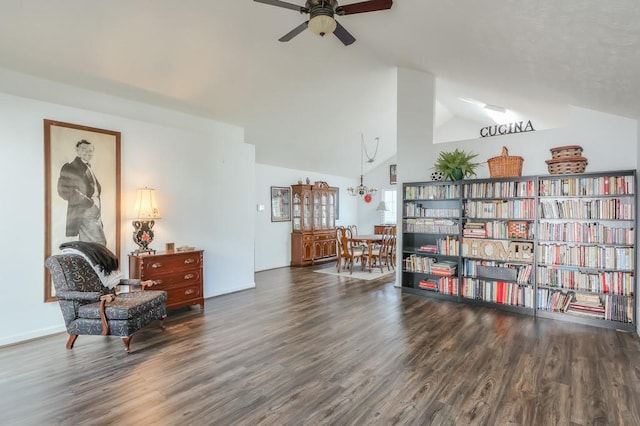 living area with lofted ceiling, wood finished floors, and a ceiling fan