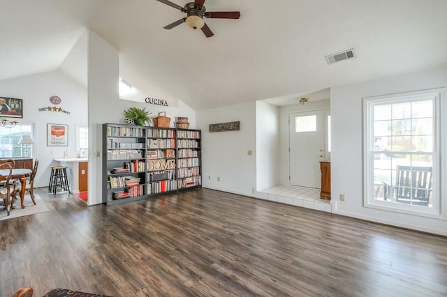 living room featuring visible vents, a healthy amount of sunlight, and wood finished floors