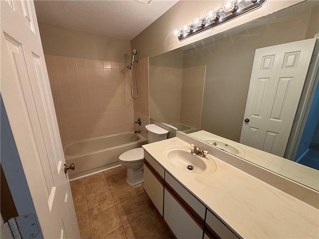 bathroom featuring vanity, bathtub / shower combination, a textured ceiling, tile patterned floors, and toilet