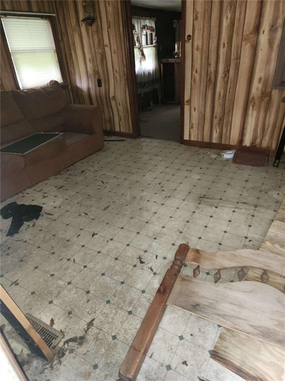 45 Oakwood Dr, Oglethorpe, GA 31068 - bathroom featuring wood walls and tile patterned floors