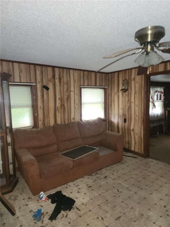 45 Oakwood Dr, Oglethorpe, GA 31068 - living room with wooden walls, ceiling fan, and a textured ceiling