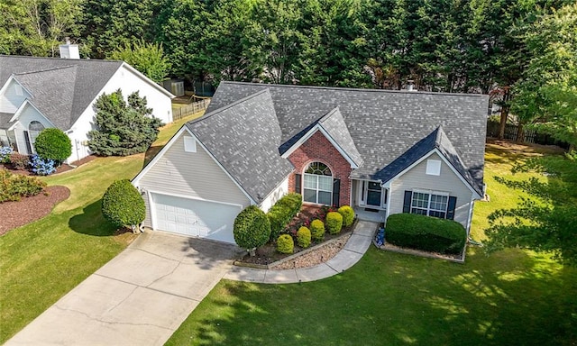 3313 Harmon Ridge Ct, Buford, GA 30519 - view of front of home with an attached garage, driveway, a front lawn, brick siding, and roof with shingles