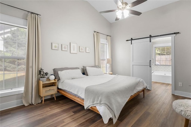 3313 Harmon Ridge Ct, Buford, GA 30519 - bedroom featuring a barn door, vaulted ceiling, dark wood-style floors, baseboards, and ceiling fan