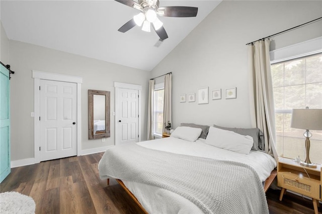 3313 Harmon Ridge Ct, Buford, GA 30519 - bedroom featuring wood finished floors, multiple windows, baseboards, and high vaulted ceiling