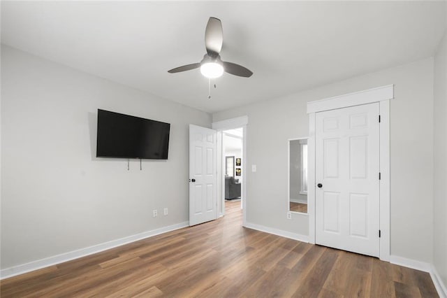 3313 Harmon Ridge Ct, Buford, GA 30519 - unfurnished bedroom featuring wood finished floors, baseboards, and a ceiling fan
