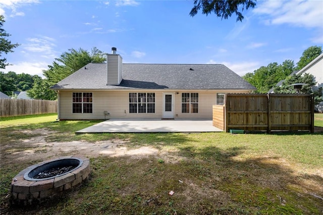 3313 Harmon Ridge Ct, Buford, GA 30519 - back of property featuring a patio area, a chimney, a fire pit, and a shingled roof