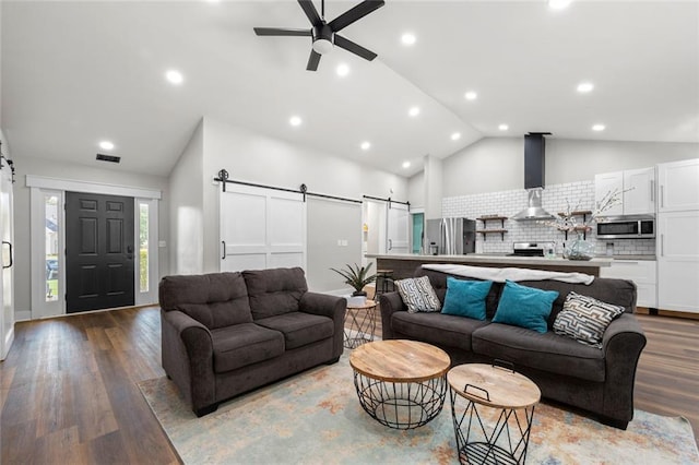 3313 Harmon Ridge Ct, Buford, GA 30519 - living area featuring a barn door, ceiling fan, wood finished floors, recessed lighting, and high vaulted ceiling