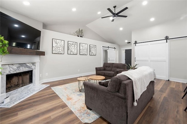 3313 Harmon Ridge Ct, Buford, GA 30519 - living area featuring a barn door, a ceiling fan, vaulted ceiling, recessed lighting, and baseboards