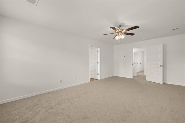 empty room featuring light carpet and ceiling fan