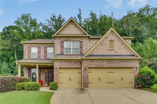 craftsman-style home featuring driveway and a front lawn