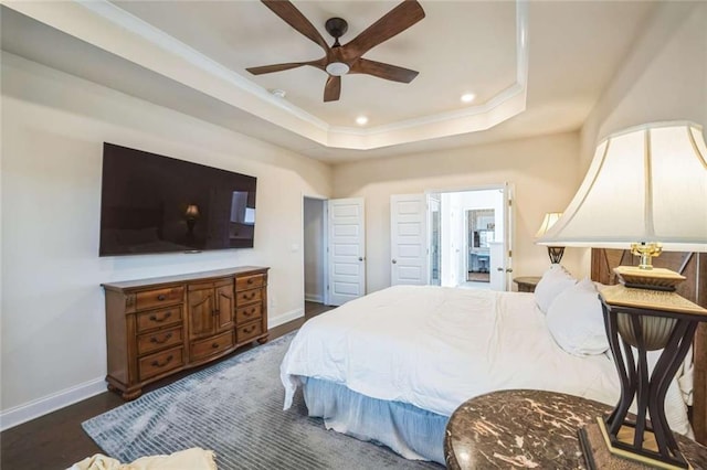 bedroom with baseboards, a raised ceiling, dark wood-type flooring, and recessed lighting