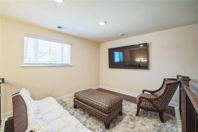 sitting room featuring visible vents and baseboards