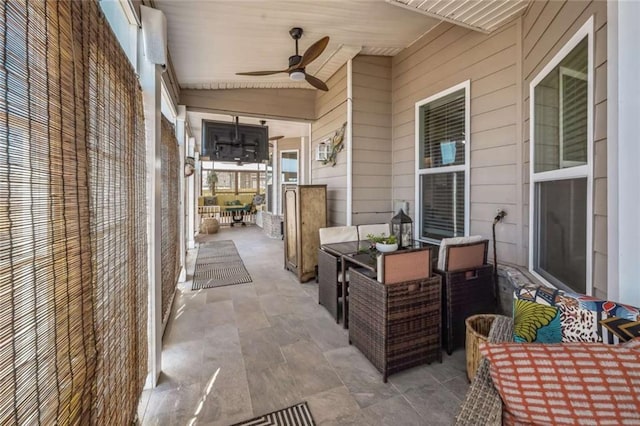 view of patio with a ceiling fan and outdoor lounge area