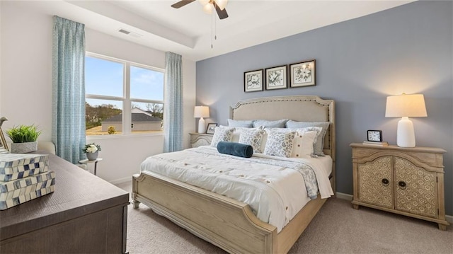 bedroom with light carpet and ceiling fan