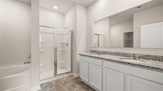 bathroom with vanity and plus walk in shower