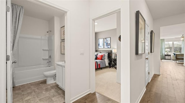 hallway with light hardwood / wood-style flooring