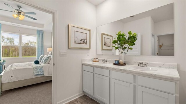 bathroom featuring ceiling fan and vanity