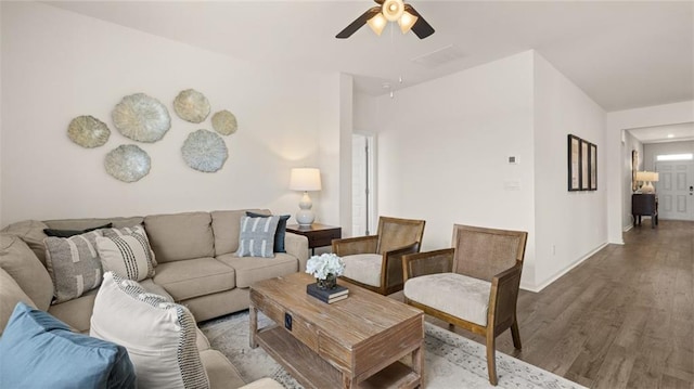 living room with hardwood / wood-style flooring and ceiling fan