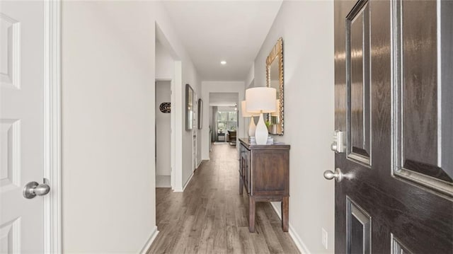 corridor featuring light hardwood / wood-style floors