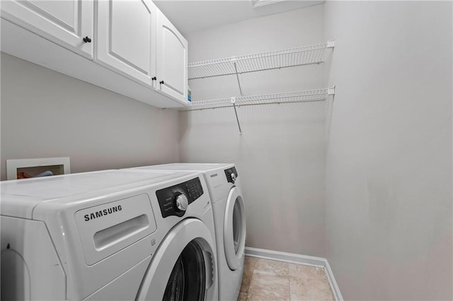 3174 Vickery Dr NE, Marietta, GA 30066 - clothes washing area featuring independent washer and dryer, cabinet space, and baseboards