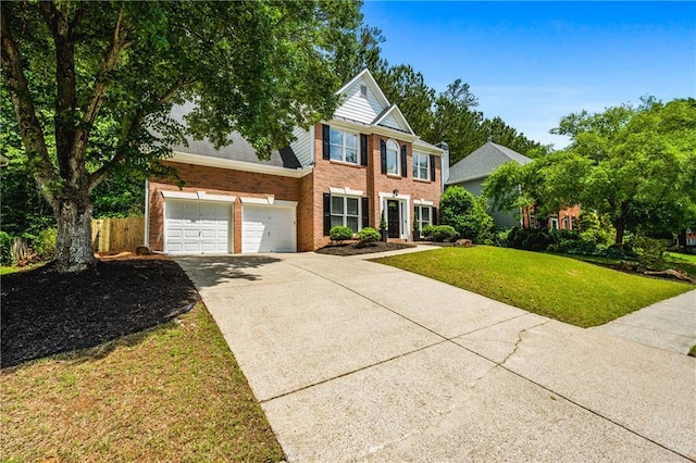 3174 Vickery Dr NE, Marietta, GA 30066 - view of front facade with driveway, brick siding, and a garage