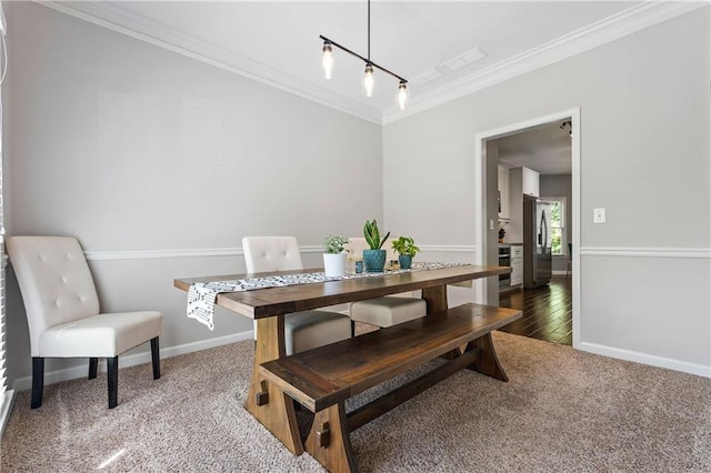 3174 Vickery Dr NE, Marietta, GA 30066 - carpeted dining room featuring crown molding and baseboards
