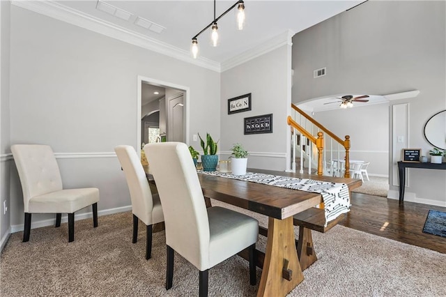 3174 Vickery Dr NE, Marietta, GA 30066 - dining space featuring stairs, crown molding, carpet flooring, ceiling fan, and baseboards