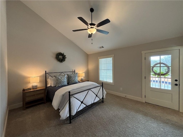 bedroom featuring carpet, multiple windows, lofted ceiling, and baseboards