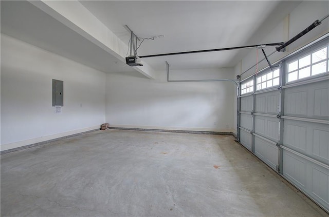 garage with electric panel, baseboards, and a garage door opener