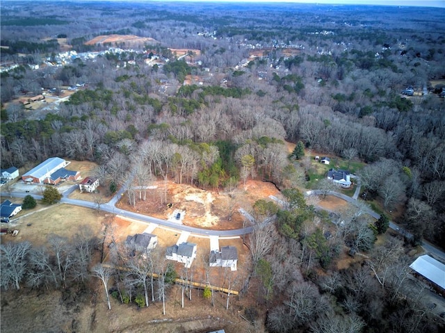 drone / aerial view with a view of trees