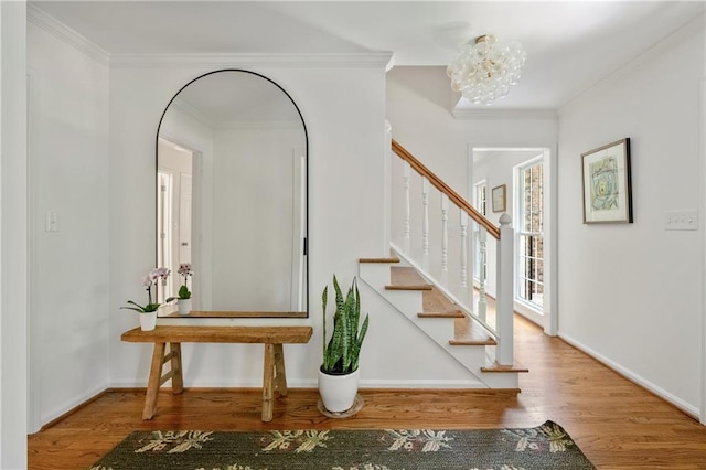 6960 Hunters Branch Dr, Atlanta, GA 30328 - stairway featuring wood finished floors, ornamental molding, and a chandelier