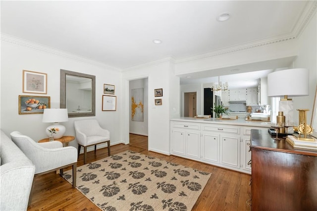 6960 Hunters Branch Dr, Atlanta, GA 30328 - living room featuring a chandelier, crown molding, light wood-style floors, and recessed lighting