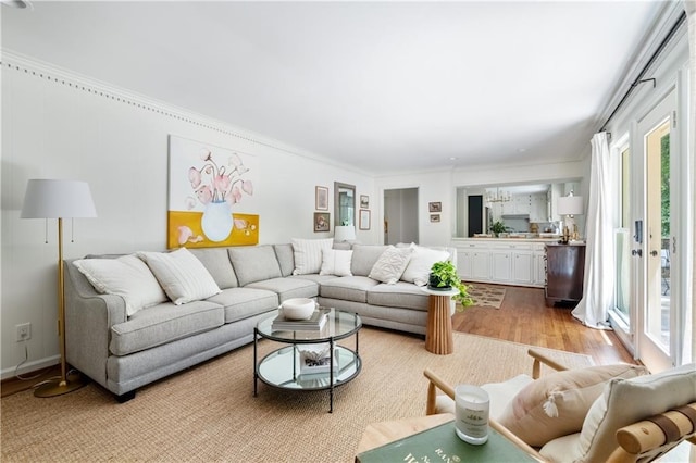 6960 Hunters Branch Dr, Atlanta, GA 30328 - living room with light wood-type flooring and crown molding