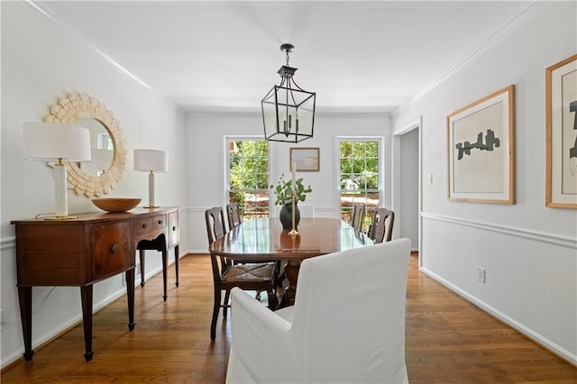 6960 Hunters Branch Dr, Atlanta, GA 30328 - dining space featuring a chandelier, ornamental molding, and wood finished floors