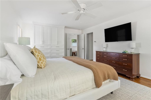 6960 Hunters Branch Dr, Atlanta, GA 30328 - bedroom featuring wood finished floors, ceiling fan, and a closet