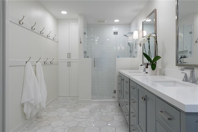 6960 Hunters Branch Dr, Atlanta, GA 30328 - bathroom featuring double vanity, a shower stall, tile patterned flooring, and recessed lighting