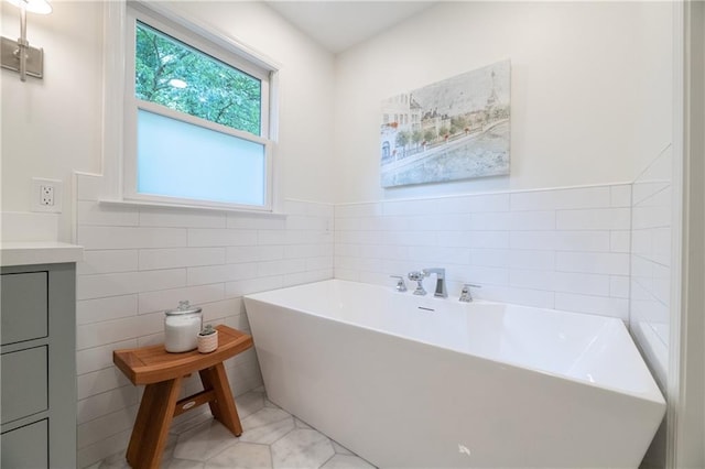 6960 Hunters Branch Dr, Atlanta, GA 30328 - full bathroom with a freestanding tub, vanity, and tile walls