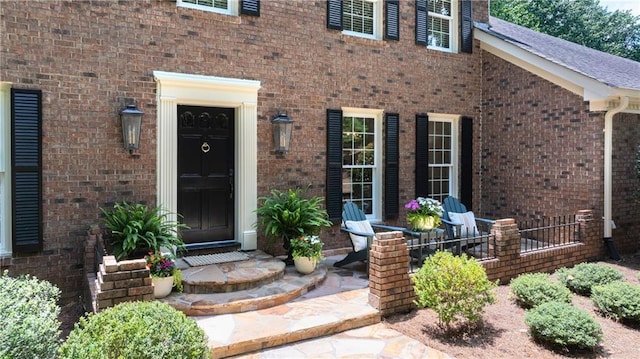 6960 Hunters Branch Dr, Atlanta, GA 30328 - doorway to property with brick siding and covered porch