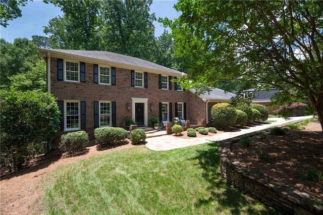 6960 Hunters Branch Dr, Atlanta, GA 30328 - colonial-style house with brick siding and a front lawn