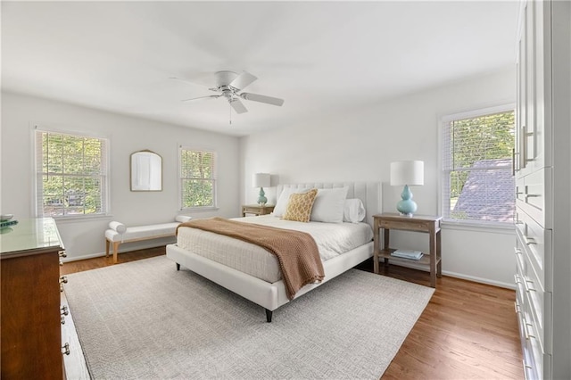 6960 Hunters Branch Dr, Atlanta, GA 30328 - bedroom with wood finished floors and a ceiling fan