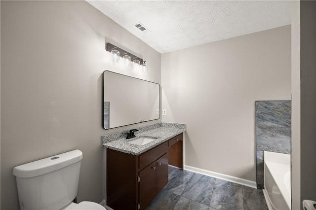 3208 Navajo Cir, Gainesville, GA 30501 - full bath with vanity, a garden tub, toilet, a textured ceiling, and baseboards