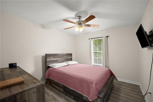 3208 Navajo Cir, Gainesville, GA 30501 - bedroom featuring wood finished floors, a ceiling fan, baseboards, and a textured ceiling