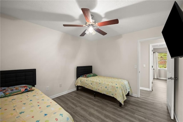 3208 Navajo Cir, Gainesville, GA 30501 - bedroom featuring baseboards, wood finished floors, and a ceiling fan