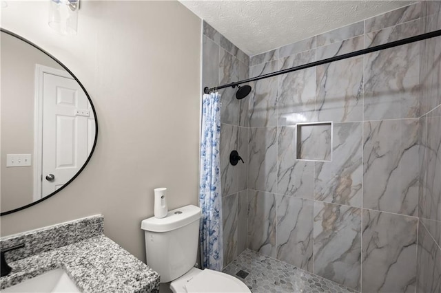 3208 Navajo Cir, Gainesville, GA 30501 - bathroom featuring tiled shower, toilet, vanity, and a textured ceiling