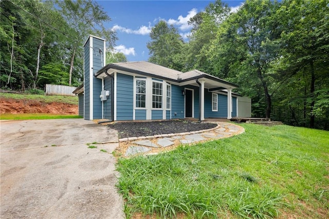 3208 Navajo Cir, Gainesville, GA 30501 - view of front of home featuring a chimney, a front lawn, and driveway