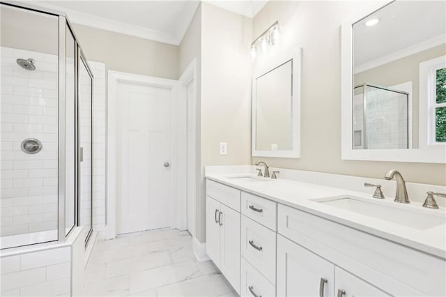 bathroom featuring an enclosed shower, vanity, and crown molding