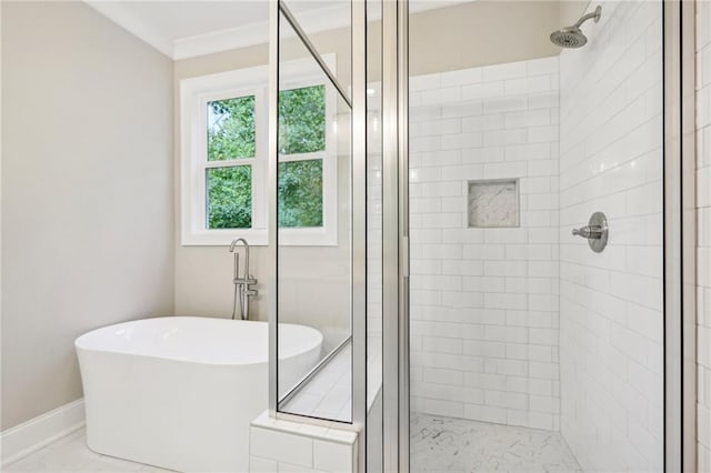 bathroom featuring ornamental molding and plus walk in shower